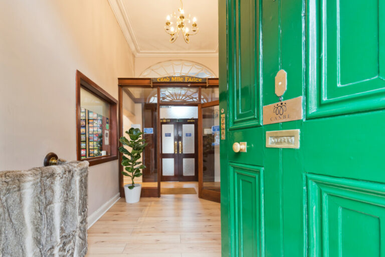 Front door slightly open, welcoming you to Canbe Hostels - Gardiner House