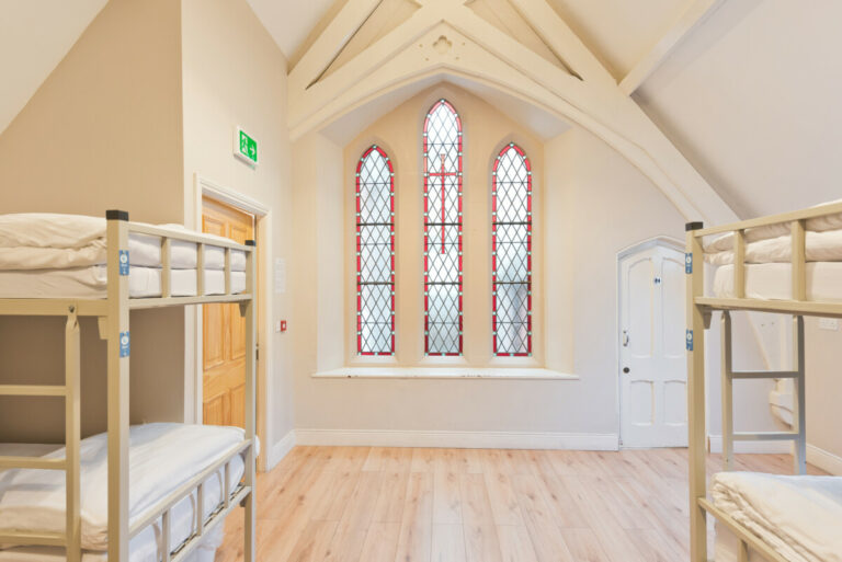 Another view of dorm with beautiful window at Canbe Hostels - Gardiner House