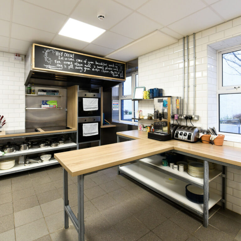 Kitchen with island counters at The Nest Boutique Hostel