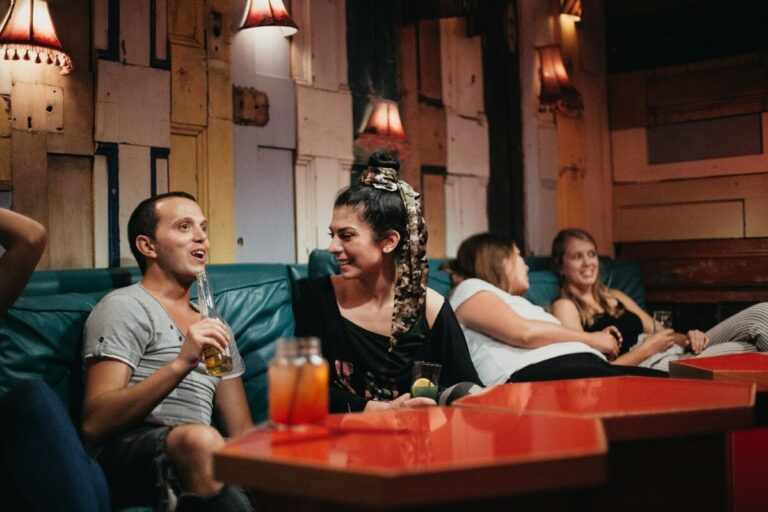 Guests socializing at a table at Clink78