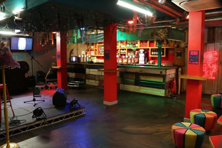 View of bar and indoor stage at Clink78 London Hostel